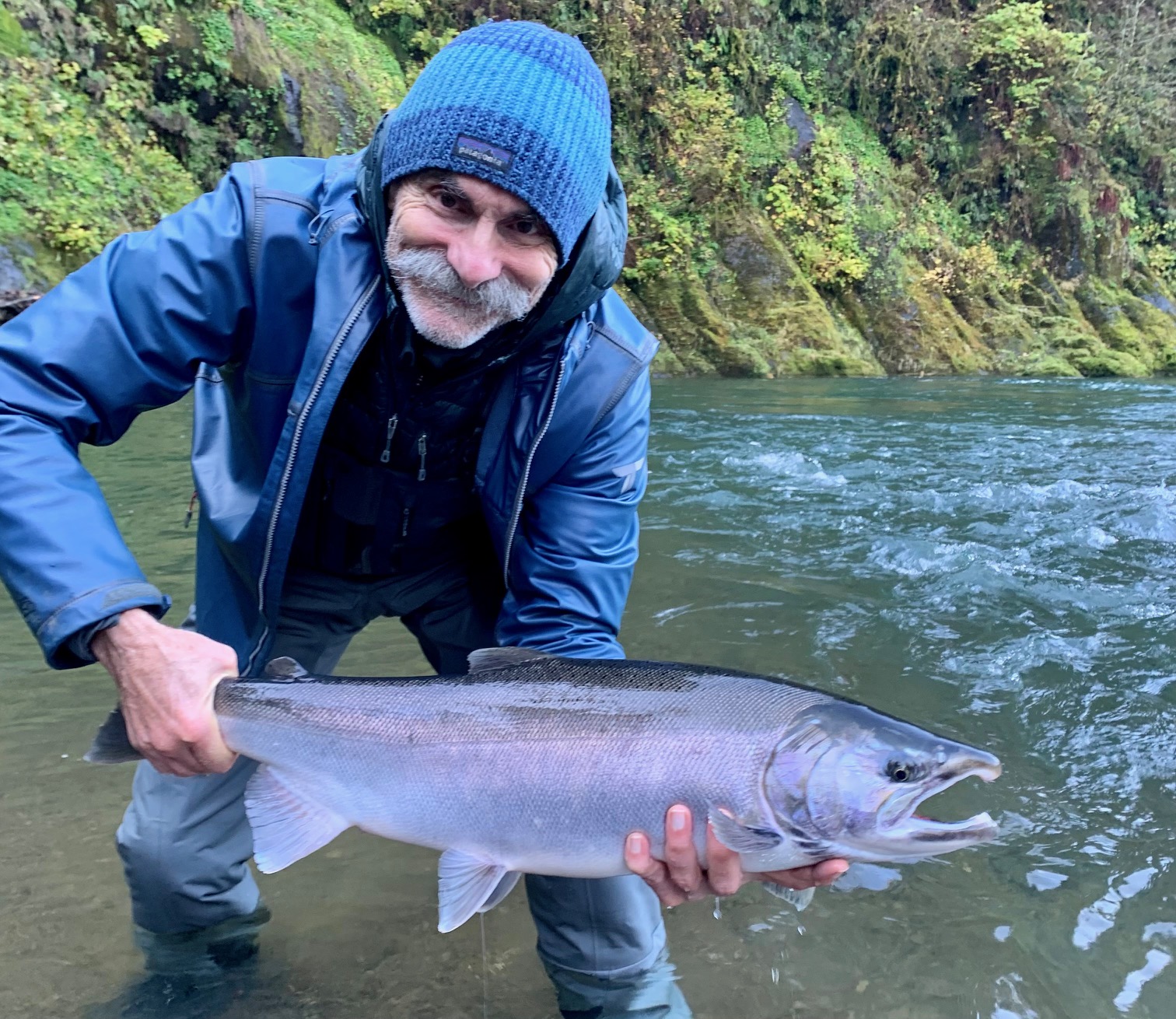 Fisherman posing with Coho Salmon on Trask River